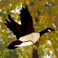 AmberGlassArt Stained glass bird - tiffany glass bird. A stained glass suncatcher.