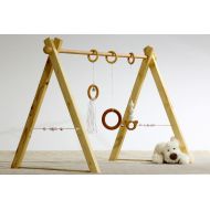 BbCamino Portico of awakening, baby gym, white, 3 rings and spheres in wood on the sides.