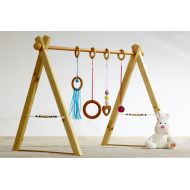 BbCamino Portico educational Montessori baby gym, multicolored version, 4 rattles and spheres in wood on the sides.