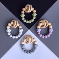 /BiteaBead Rattling teether. Pastel colors