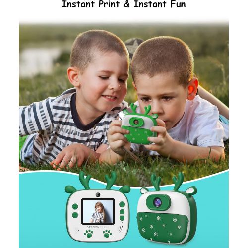  Dragon Touch Instant Print Kids Camera, InstantFun2 Digital Camera with Dual Camera Lens, Print Paper, Cartoon Sticker, Color Pens and Camera Bag for Girls and Boys(Christmas Green