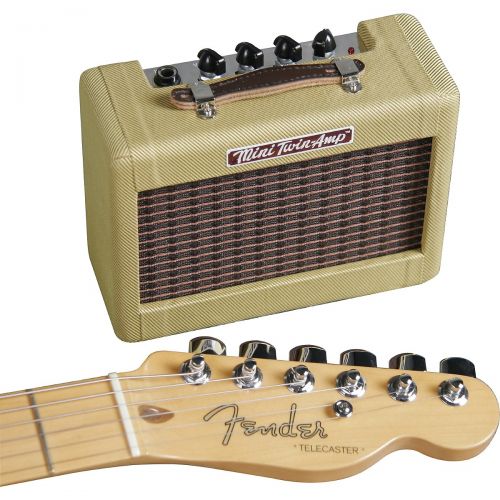  Fender},description:The Mini 57 Twin is a super-cool little jammer with a realistic vintage visual vibe. The genuine tweed-covered wood cab contains built-in distortion; power, vol