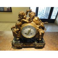 Fifthaveantiques Antique French Cupid Clock Circa 1880 Marble Base with Antique French Movement.