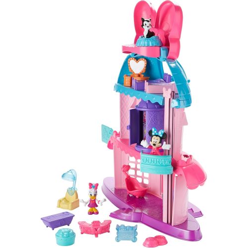  Fisher-Price Minnie Mouses Home Sweet Headquarters is a 4 level dollhouse playset with five rooms of play and features three figures, 12 play pieces, an elevator, and Minnies magic Turnstyler f