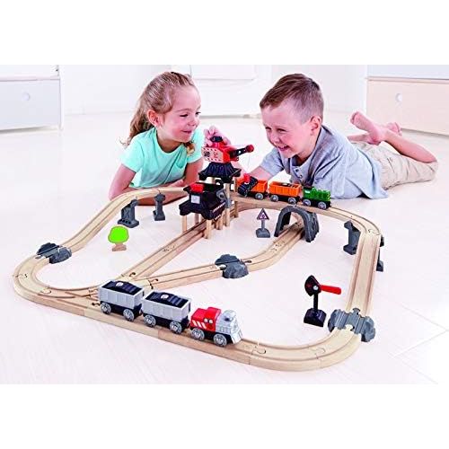 Hape Crane and Cargo Train Set | Wooden Railway Toy Set with Magnetic Crane, Button Operated Loader and Adjustable Rail Signal