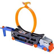 Hot Wheels Stunt & Go Track Set with 1 Toy Car, Transforming Hauler Truck with Launcher, Stores 18 1:64 Scale Cars