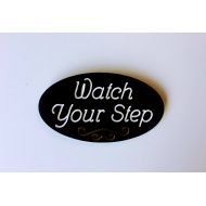 IvysWoodCreations Watch Your Step Oval Outdoor Decor Wood Engraved PlaqueBlack and White