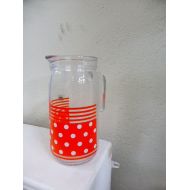 /JECHINEPOURVOUS Glass jar made in italy, white polka dots on vintage orange 1970