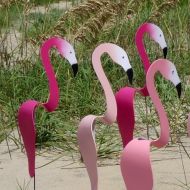 Jbbrownandcompany Swirling Pink Flamingos.Kinetic garden birds that twirl and bob up and down with the slightest breeze. Select your favorite shade of pink.