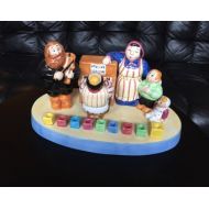 JudaicaShopandMore Family around the piano menorah