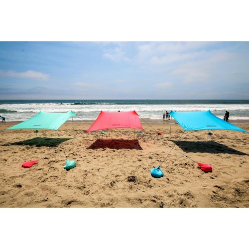  Mad Grit Best XL Portable Beach Shade, Sun Shelter, Canopy Sail Tent, Large Sunshade - Includes Carrying Bag, 2 Poles, 2 Stakes for Park/Grass Use, Elastic Lycra Sail, and 4 sandbags.