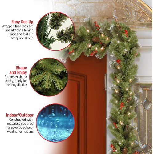  National Tree Company Pre-Lit Artificial Christmas Garland, Green, Crestwood Spruce, White Lights, Decorated with Pine Cones, Berry Clusters, Plug In, Christmas Collection, 9 Feet