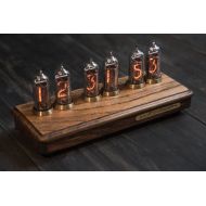 /PastIndicator Nixie tube clock in oak and brass case