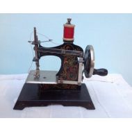 Pimprenellerose Antique toy sewing machine, childs toy numbered, vintage sewing machine antique Tole
