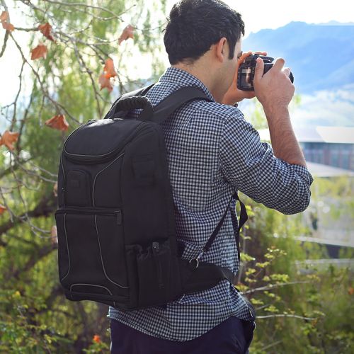  Digital SLR Camera Backpack w/ 15.6 Laptop Compartment PLUS Bonus Mini-Tripod by USA Gear features Padded Custom Dividers, Tripod Holder and Storage for DSLR Cameras by Nikon, Cano