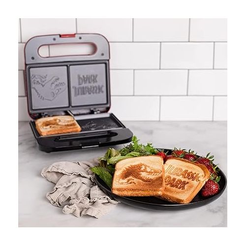  Uncanny Brands Jurassic Park Grilled Cheese Maker- Panini Press and Compact Indoor Grill- Opens 180 Degrees for Burgers, Steaks, Bacon, Non-Stick Surface