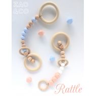 /Etsy Baby rattle teething toy pram play gym wood beech silicone teether BPA free