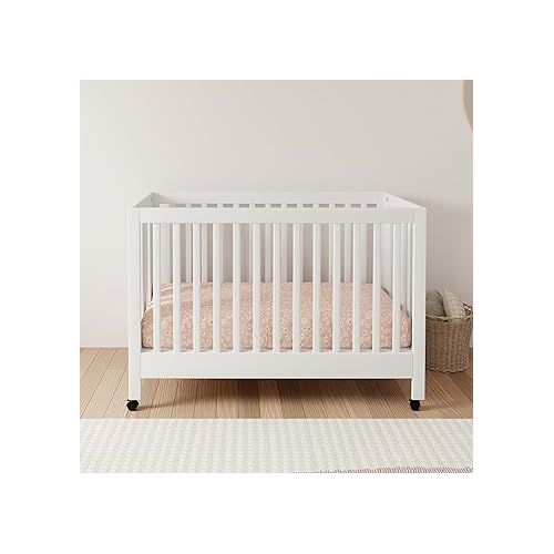  Babyletto Maki Full-Size 2-in-1 Portable Folding Crib with Toddler Bed Conversion Kit in White, Greenguard Gold Certified