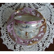 /OfftheShelf2015 Made in Japan Hand Decorated - Vintage 3-Footed Tea Cup and Laced Saucer - Pink, Blue and Gold Floral on Pearled Background with Pink Band